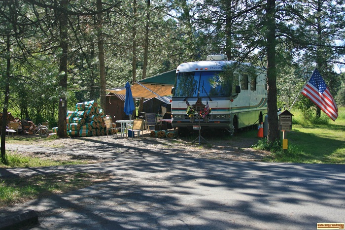 Beauty Creek Campground host with firewood for sale.