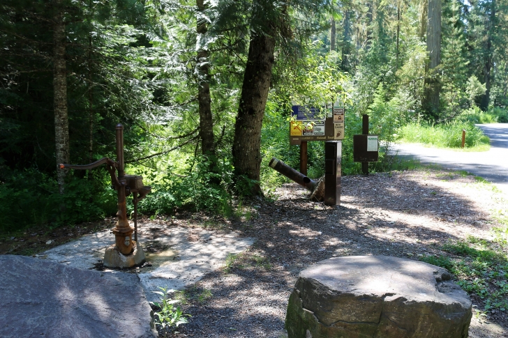 A picture of the fee drop box and hand pump equipped well at Giant White Pine Campground. I found the water to be metallic and would recommend bringing your own drinking water.