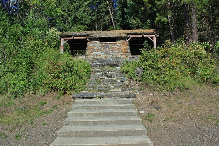 The main group shelter sits above the swimming area on a small hill.