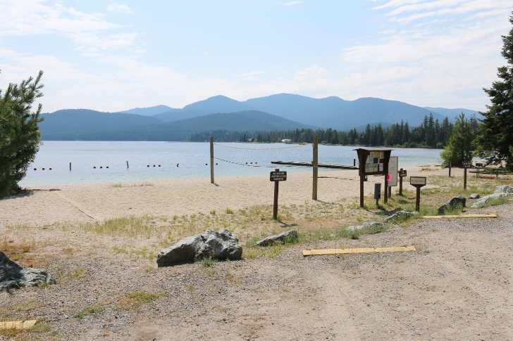 This picture shows the volleyball court, the swimming area, and Preist Lake.
