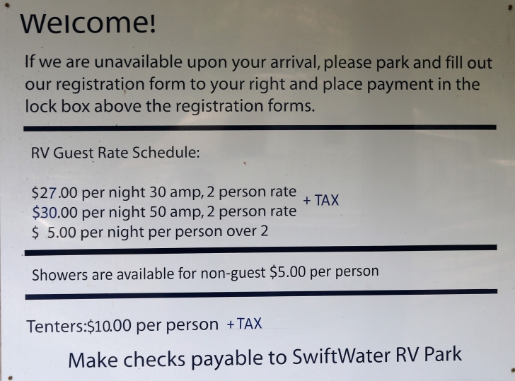 A picture of the fee schedule at Swiftwater RV Park.