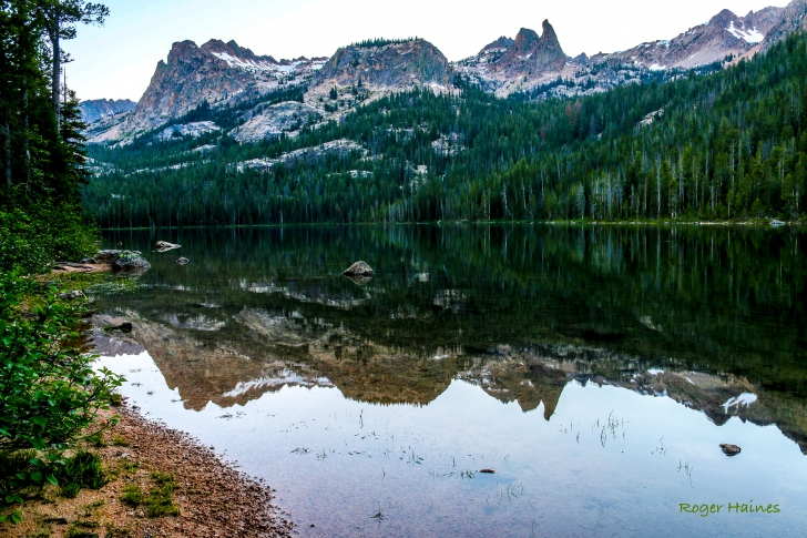 A picture of Hell Roaring Lake with the "Finger of Fate" reflected in the mirror like surface of the lake.